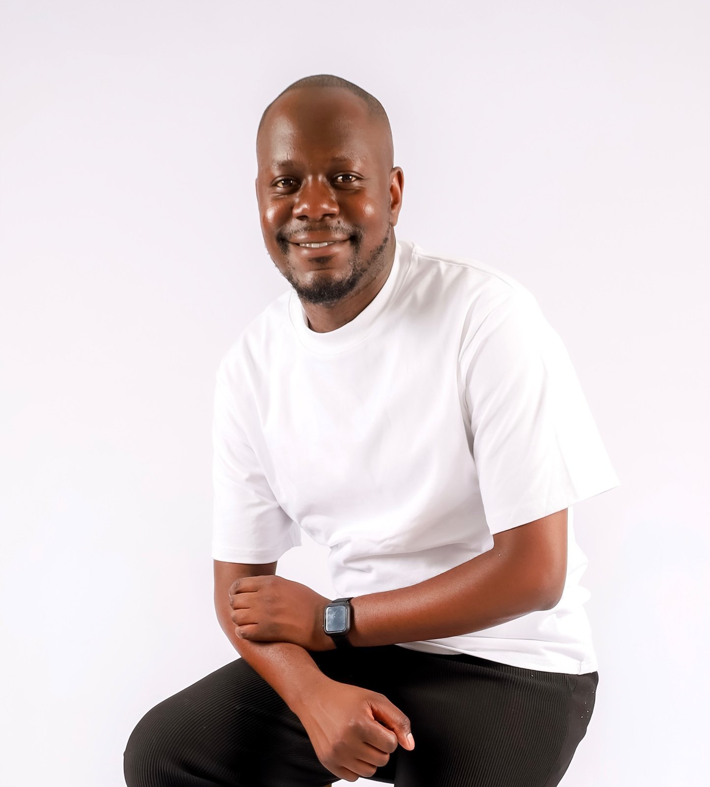 Tanyaradzwa Mapuwei smiling in a white T-shirt